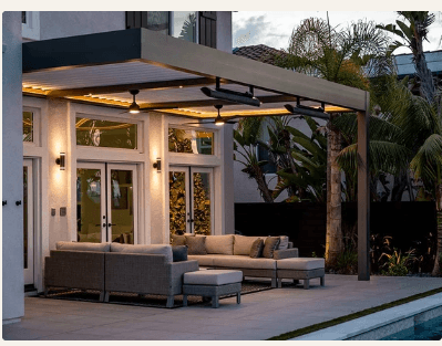 Luxury outdoor living space with Azenco pergola, integrated lighting, and patio seating at dusk