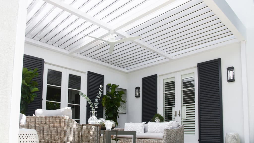 Wall mounted white R-BLADE louvered pergola