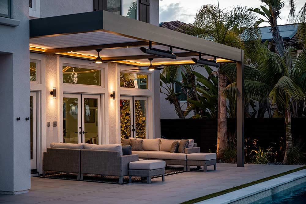 R-BLADE pergola with fans, heaters, and pool views