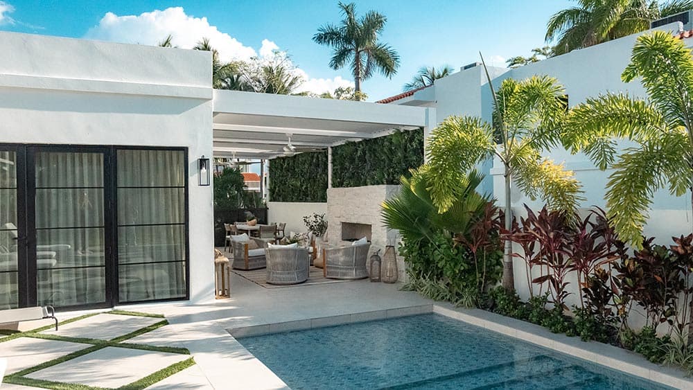 Designer pergola installation with premium outdoor furnishings