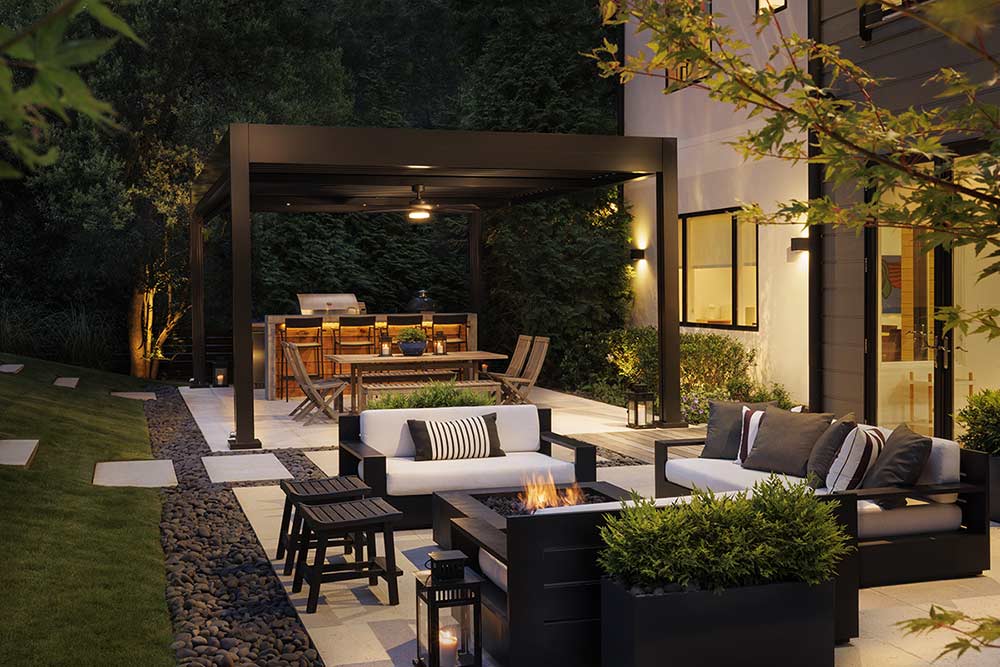 Louvered pergola extending outdoor living space beside a home