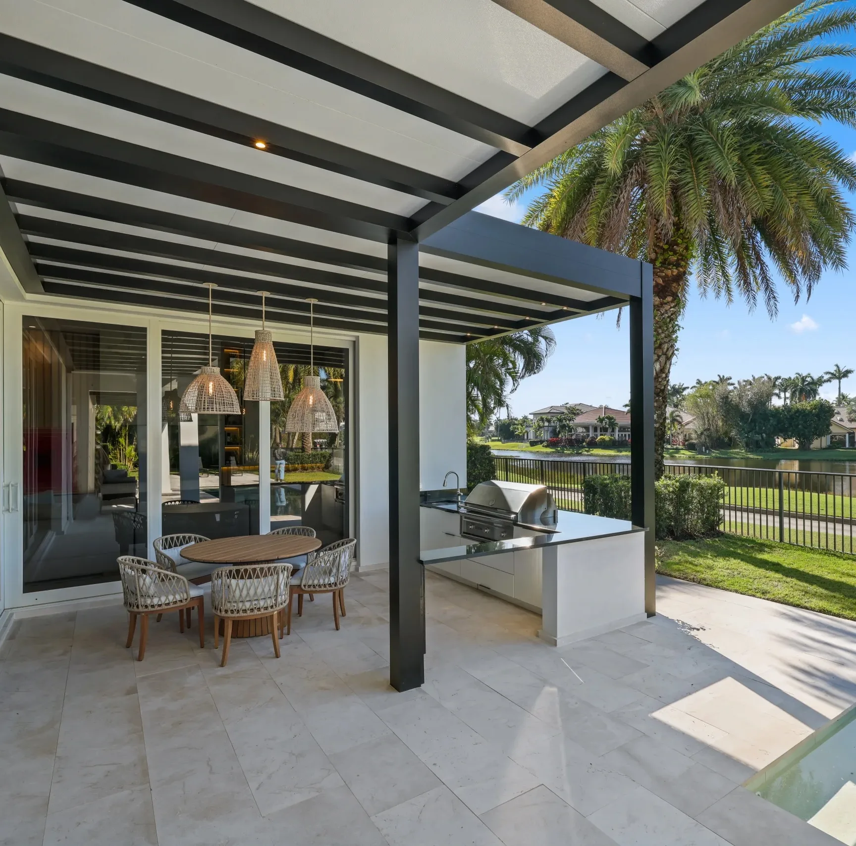 Azenco R-SHADE insulated patio cover with white roof panels and recessed lighting