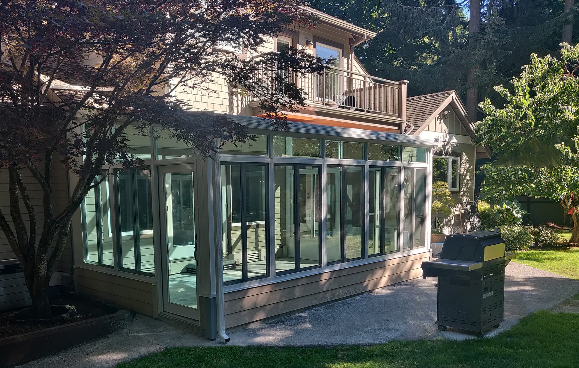 Solid roof sunroom on a home exterior